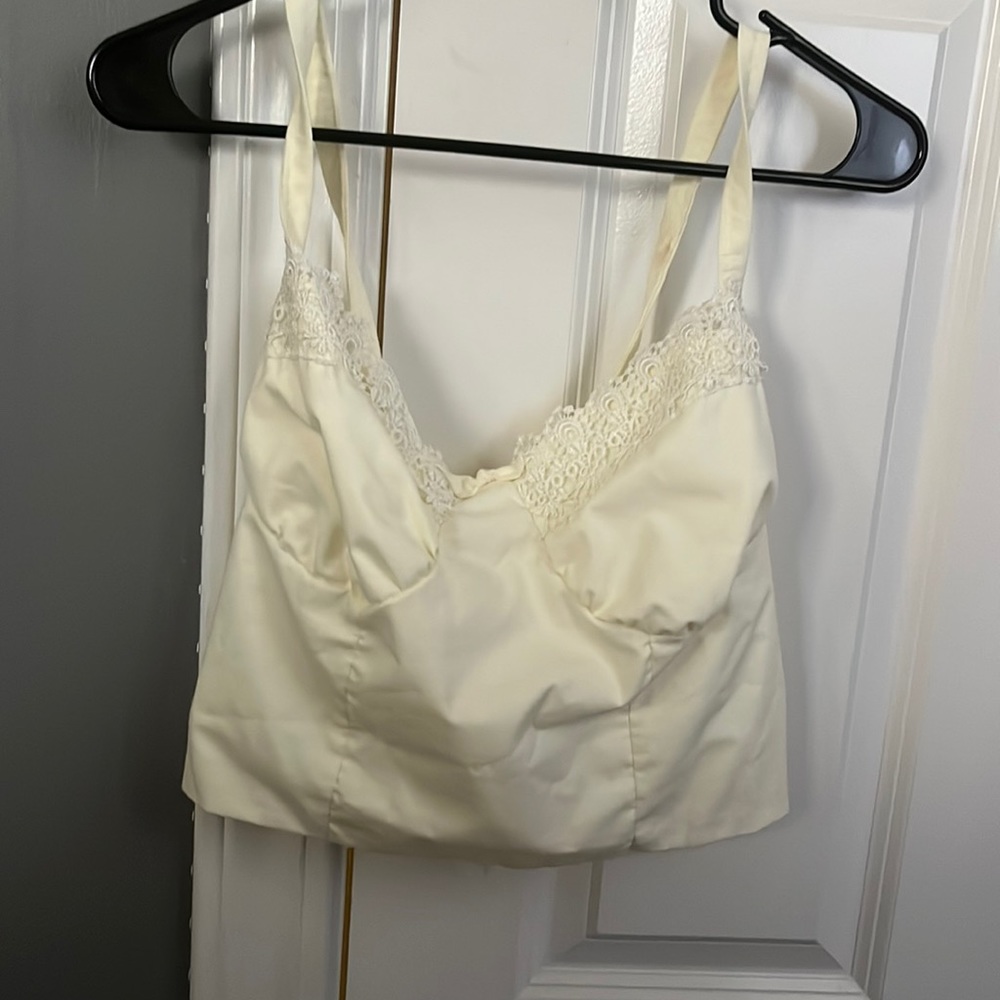 Light yellow Corset style crop top. lined with lace. size small